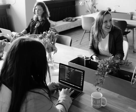 three girls working in a office